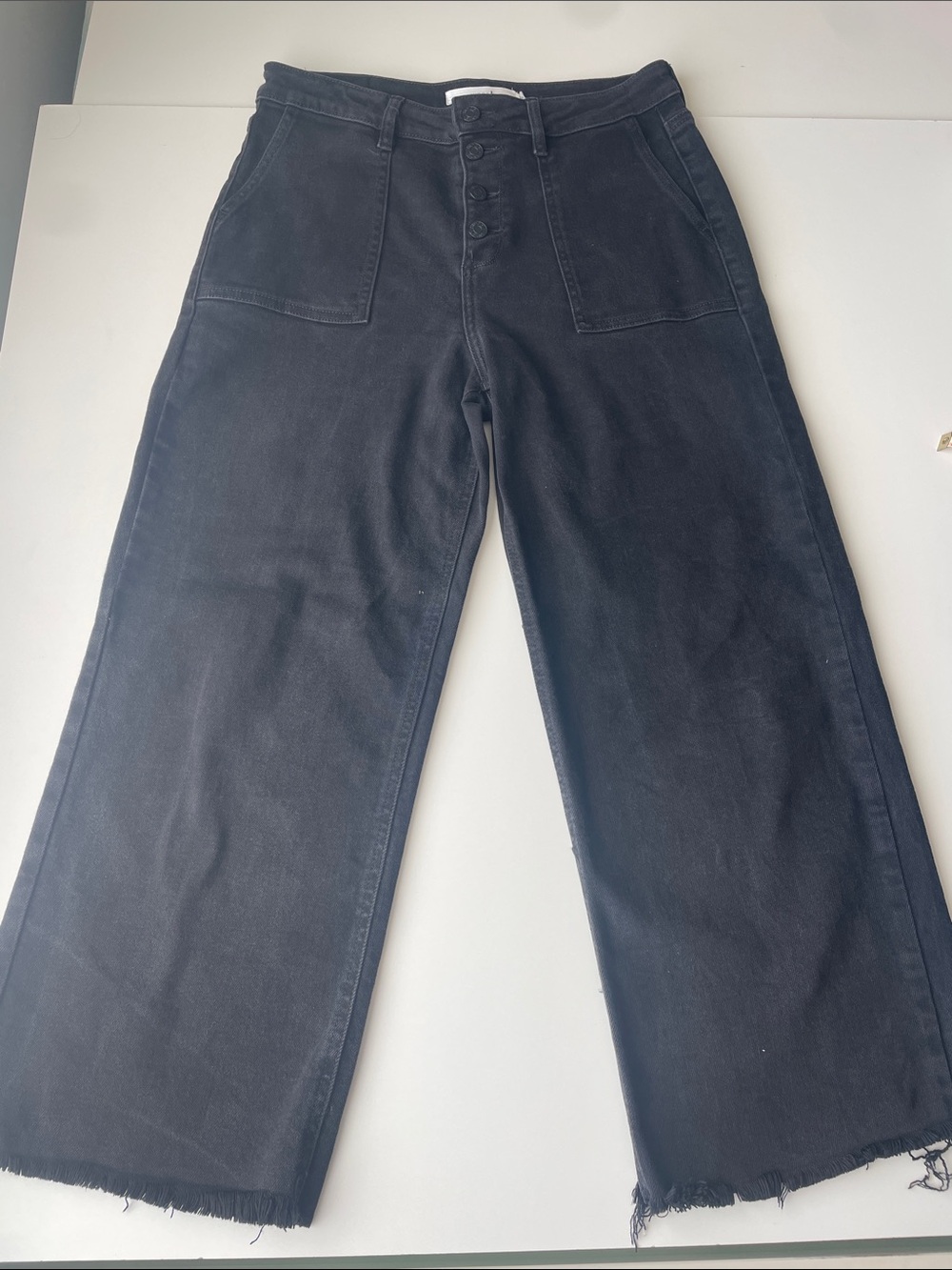 High-Rise Wide Leg Jeans in Black - Modern Raw Hem